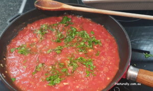 Cook down the tomato sauce until thick